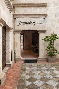 a building with a sign that says hamilion on it at Hampton by Hilton Arequipa in Arequipa