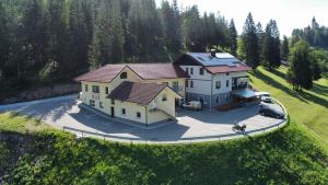 an overhead view of a large house with a driveway at Hotel and Restaurant Ana in Hrib-Loški Potok