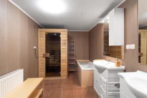 a bathroom with a sink and two sinks and a mirror at The Bookhouse, 5-bedroom residence by Prague Castle in Prague