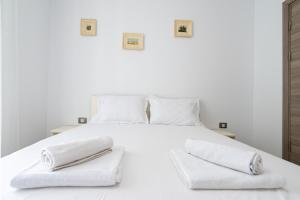 En eller flere senge i et værelse på Apartament Alexia by Alz