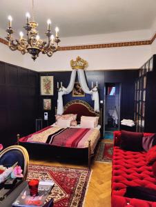 a bedroom with a king sized bed and a chandelier at Luxury near Castle in Vienna