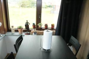 a candle on a table in front of a window at STUDIO TOUT CONFORT in Soignies +7 photos