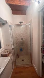 a shower with a glass door in a bathroom at A casa di Don Remo in Agnone