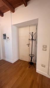 a room with a white door and a wooden floor at A casa di Don Remo in Agnone