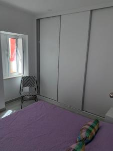 Säng eller sängar i ett rum på CASA CANELAS