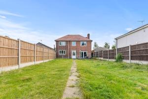 an empty yard in front of a brick house at Stunning 5 Bed in Peak District Gem - Games Rooms in Langley Mill
