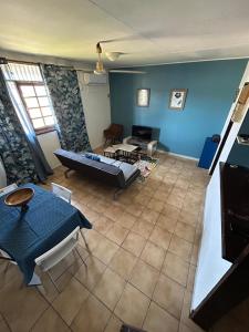 an aerial view of a living room with a couch at Le Duplex de Sainte Thérèse in Cayenne