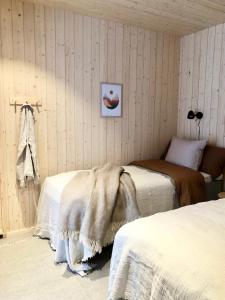 Postel nebo postele na pokoji v ubytování Villa Havu Ylläs