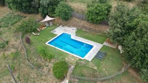 Bazén v ubytovaní El Porxo de Can Baixeres alebo v jeho blízkosti