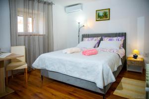 Postel nebo postele na pokoji v ubytování Apartments Faris