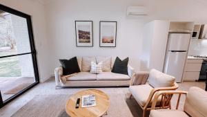 a living room with a couch and a table at Chambré Estate in Margaret River Town
