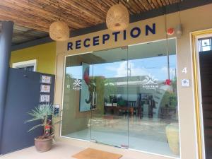 a store front with a reflection of a restaurant at Blue Palm Kata Resort in Kata Beach