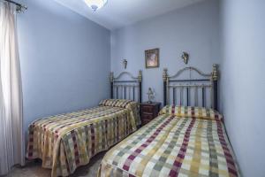 Säng eller sängar i ett rum på La Cruz de la Aurora