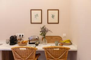 a kitchen with a counter with baskets of fruit on it at El Ombú del Agua in La Laguna