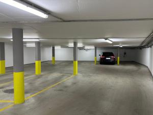 a parking garage with a car parked in it at Bettstadt Apartments in Vipiteno