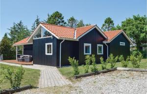 a black house with a red roof at Stunning Home In Odder With 4 Bedrooms, Sauna And Wifi in Odder