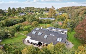 an aerial view of a house with a roof at Awesome Home In Asns With Wifi in Asnæs