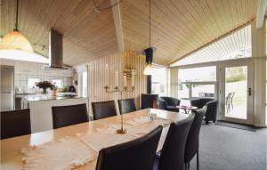 a dining room with a table and chairs at 4 Bedroom Nice Home In Ejstrupholm in Krejbjerg