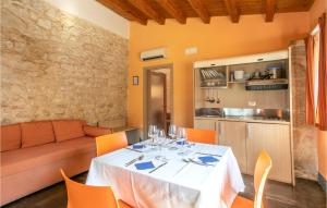a dining room with a table and a couch at Tenuta Licitra in Ragusa