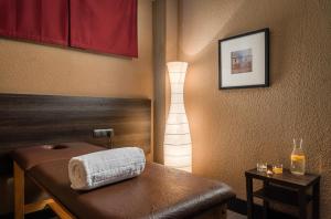 a room with a table with a towel on it at Hotel Medium Valencia in Valencia