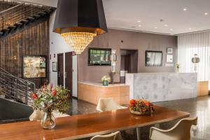 a dining room with a table and chairs at Hotel Medium Valencia in Valencia