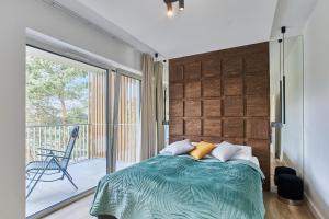 Ένα ή περισσότερα κρεβάτια σε δωμάτιο στο Apartamenty Świnoujście - Bałtycki