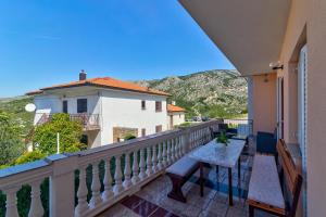 a balcony with a table and a view at Apartman Erika in Senj