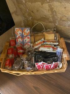 a basket filled with food and snacks on a table at Dimora Pietra Antica in Bari