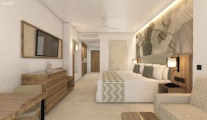 ein Hotelzimmer mit einem Bett und einem TV in der Unterkunft Riu Palace Mauritius - All Inclusive - Adults Only in Le Morne