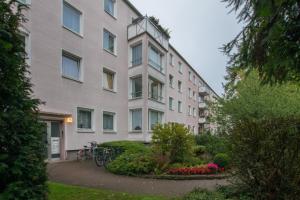 a large building with bikes parked in front of it at Private Rooms in Hannover