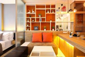 a living room with a couch and a table at Greenery living in resort condo in Chiang Mai