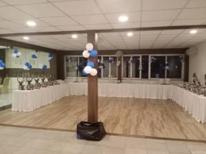 a dance floor with a pole with blue and white balloons at Amer Valley in Jaipur