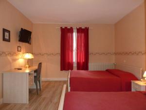 Postel nebo postele na pokoji v ubytování Hotel Le Beauregard