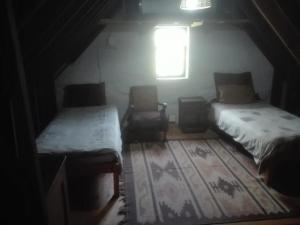 Postelja oz. postelje v sobi nastanitve Emerald Hill Cottage