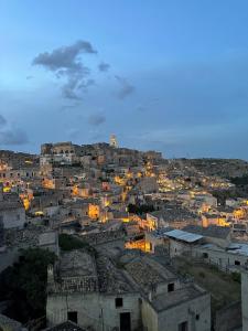a view of a city at night at Marsili Suite in Matera