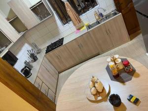 an overhead view of a kitchen with a table with food on it at Cozy City Retreat in Rubavu