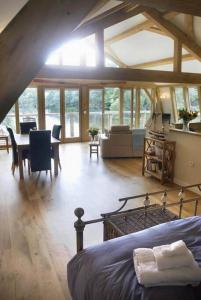 a large room with a bed and a dining room at Boat House Middleton Hall Estate in Belford
