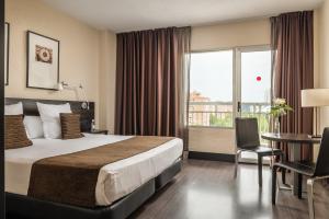 Posteľ alebo postele v izbe v ubytovaní Hotel Medium Valencia