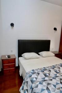Ένα ή περισσότερα κρεβάτια σε δωμάτιο στο Copacabana Vista Mar