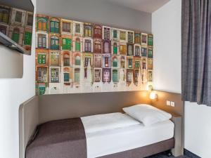 Postel nebo postele na pokoji v ubytování B&B Hotel Lübeck