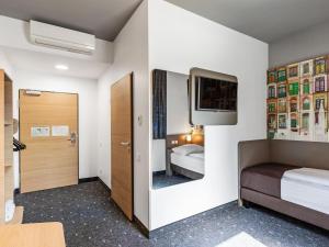 Postel nebo postele na pokoji v ubytování B&B Hotel Lübeck