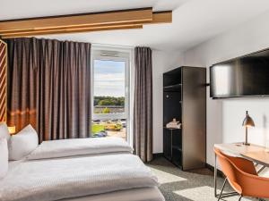Postel nebo postele na pokoji v ubytování B&B Hotel Lübeck