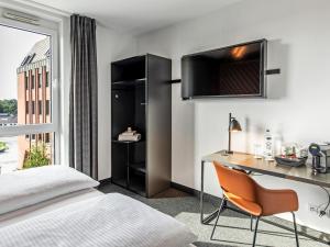 Postel nebo postele na pokoji v ubytování B&B Hotel Lübeck