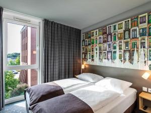 Postel nebo postele na pokoji v ubytování B&B Hotel Lübeck + 22 fotografií