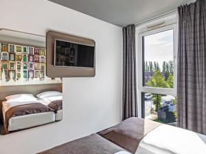Postel nebo postele na pokoji v ubytování B&B Hotel Lübeck