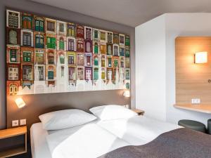 Krevet ili kreveti u jedinici u okviru objekta B&B Hotel Lübeck