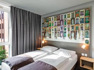 Postel nebo postele na pokoji v ubytování B&B Hotel Lübeck