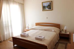 Postel nebo postele na pokoji v ubytování Villa Anggela