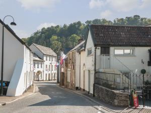 an empty street in a small town with houses at The Snug in Dulverton