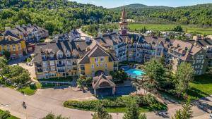 an aerial view of a resort with a building at Tour des Voyageurs in Mont-Tremblant